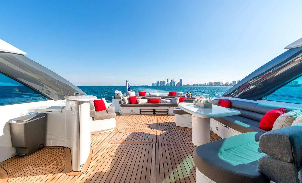 a deck with a view of the water and boats aboard PRIVEE Yacht for Sale