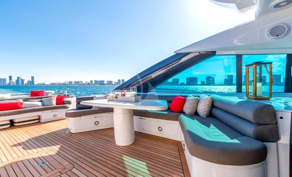 a large lounge area with a large deck and a large body of water aboard PRIVEE Yacht for Sale