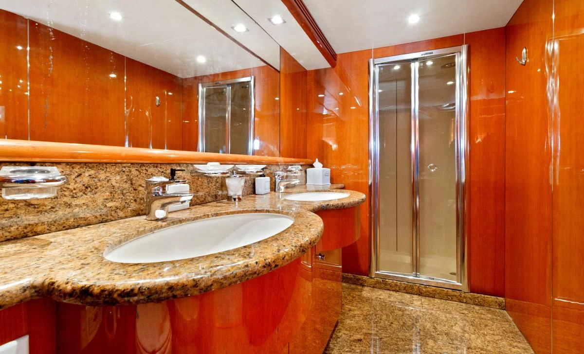 a bathroom with a marble countertop aboard PRIVEE Yacht for Sale