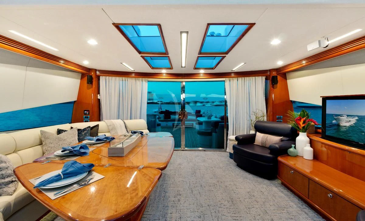 a living room with a large window aboard PRIVEE Yacht for Sale