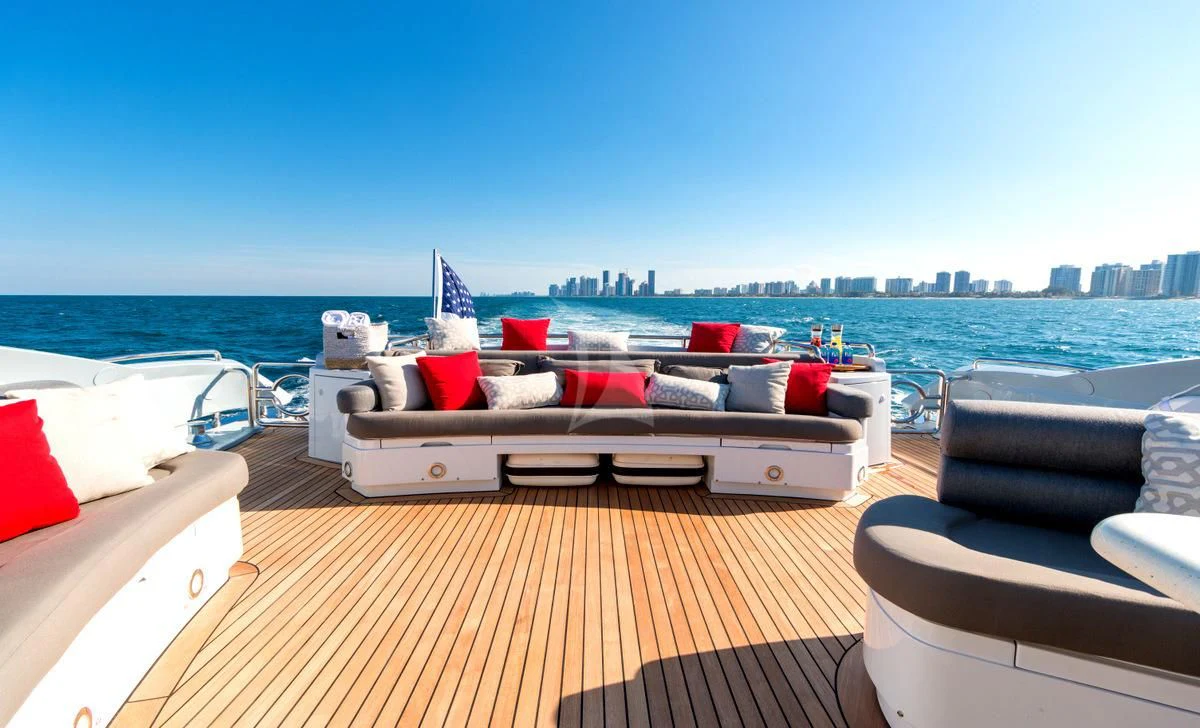 a deck with a couch and pillows on it aboard PRIVEE Yacht for Sale