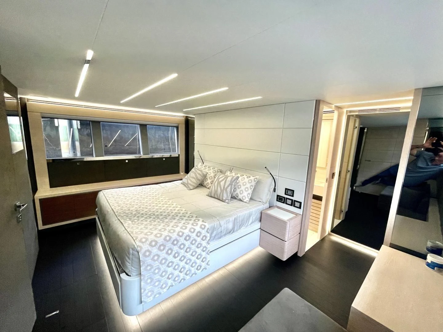 a bedroom with a bed and a television aboard AGRODOLCE Yacht for Sale