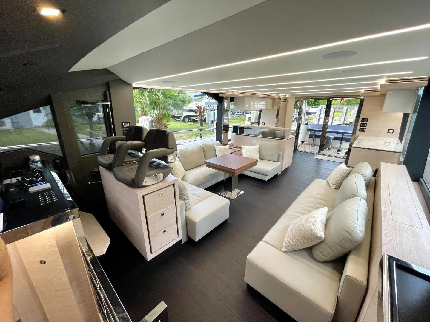 a living room with a couch and a table aboard AGRODOLCE Yacht for Sale