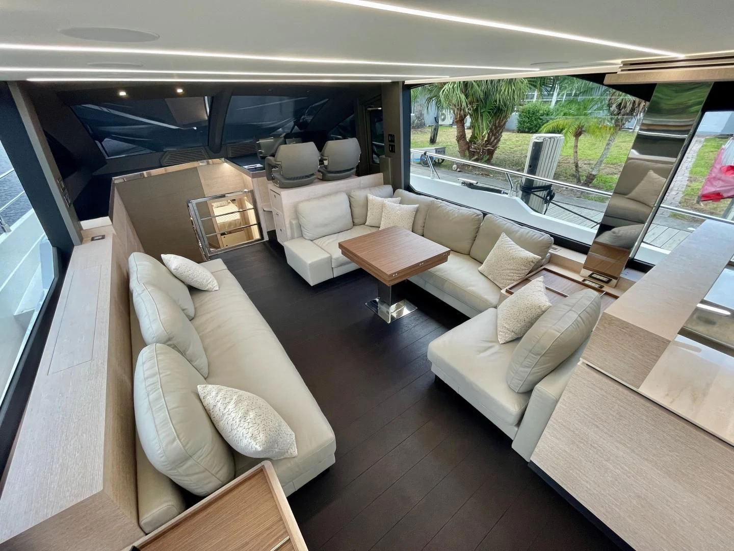 a living room with a large patio aboard AGRODOLCE Yacht for Sale