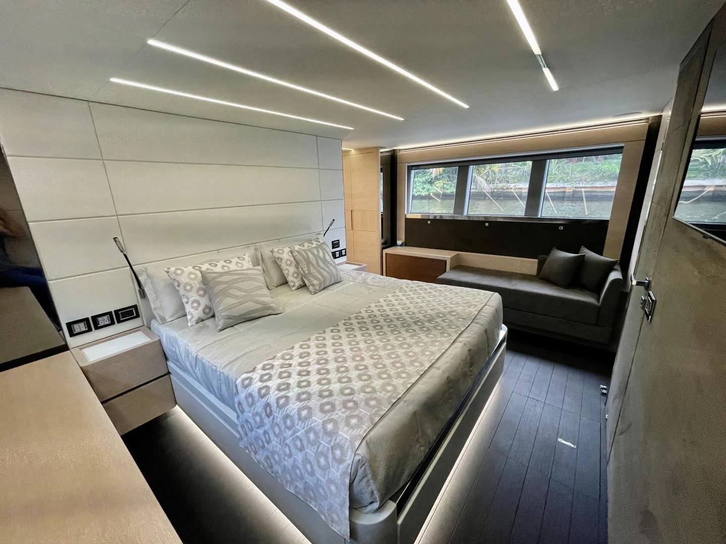 a room with a bed and a couch aboard AGRODOLCE Yacht for Sale