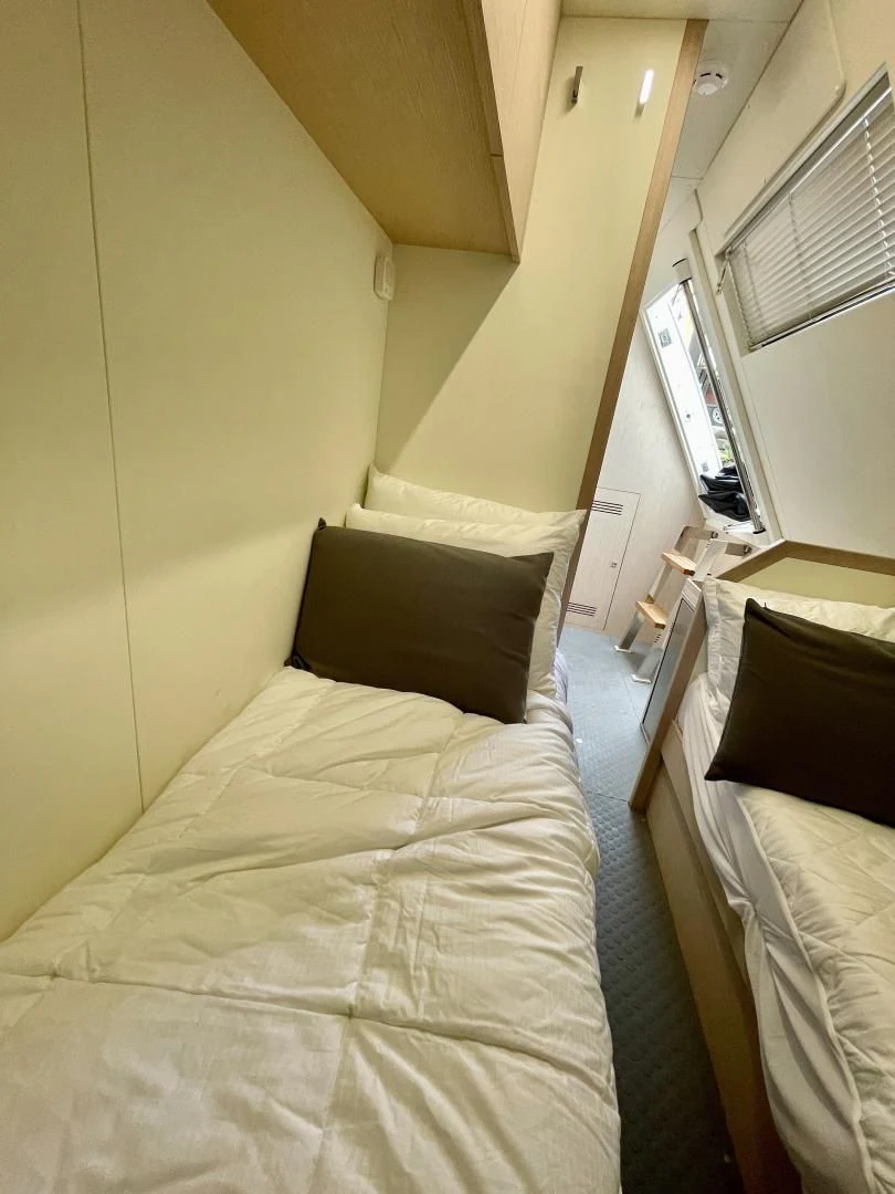 a bed in a room aboard AGRODOLCE Yacht for Sale
