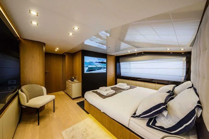 a bedroom with a large bed aboard DAMARI Yacht for Charter