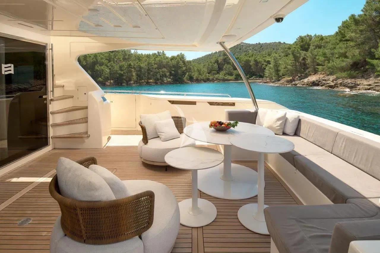 a patio with a table and chairs aboard DAMARI Yacht for Charter