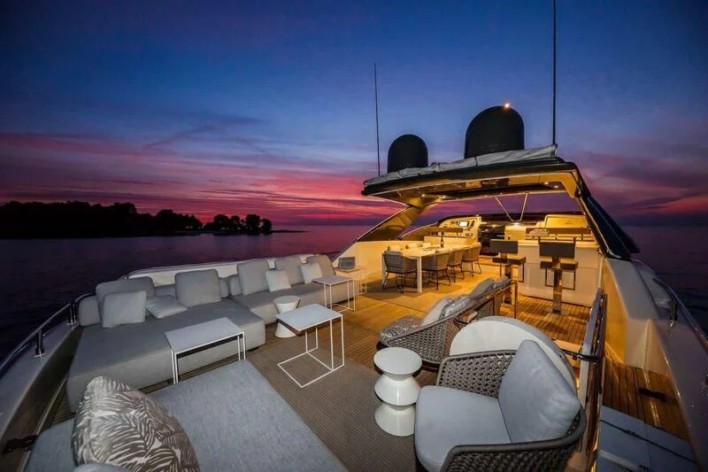 a large cruise ship at night aboard DAMARI Yacht for Charter