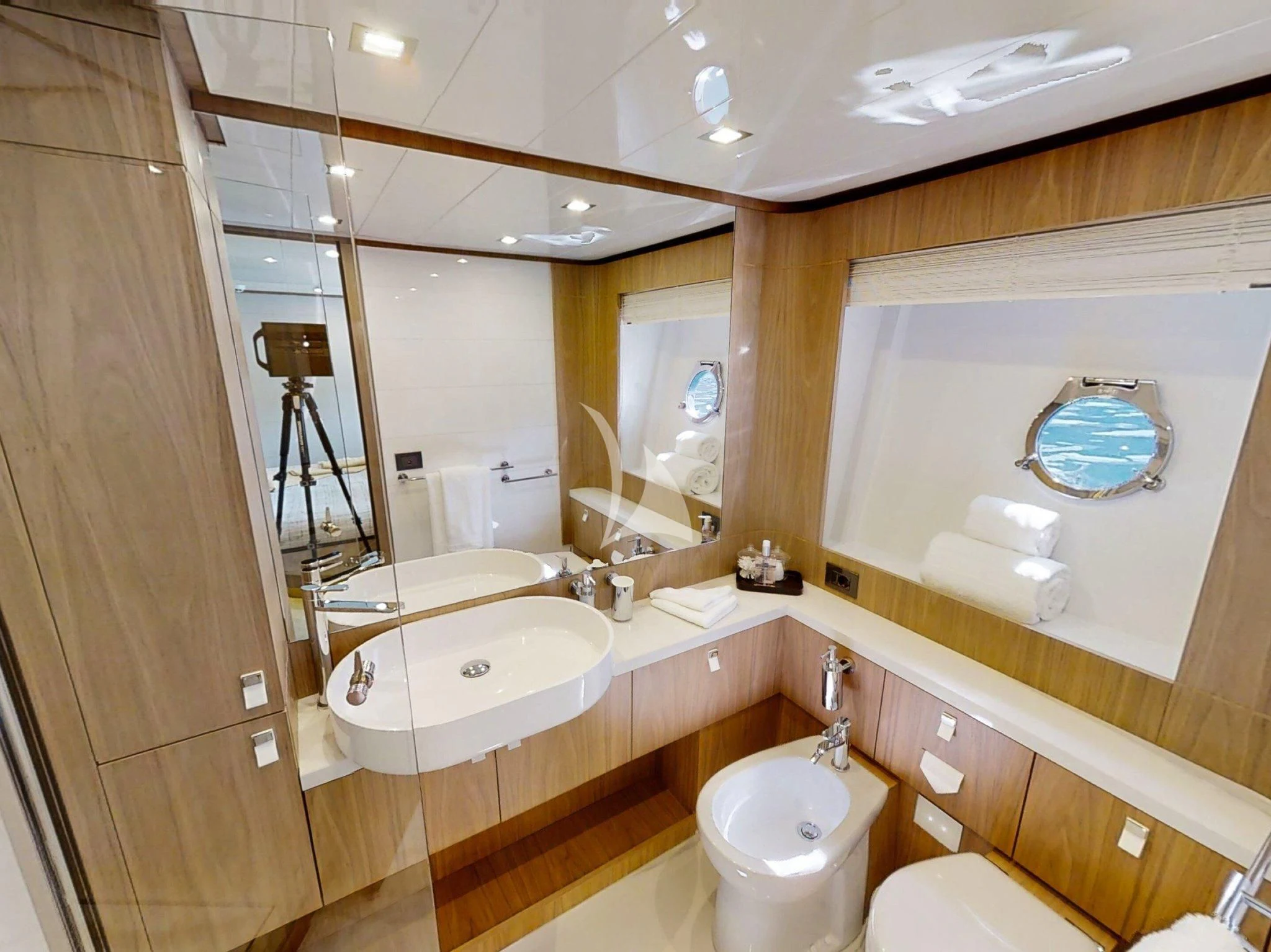 a bathroom with a large mirror aboard DAMARI Yacht for Charter