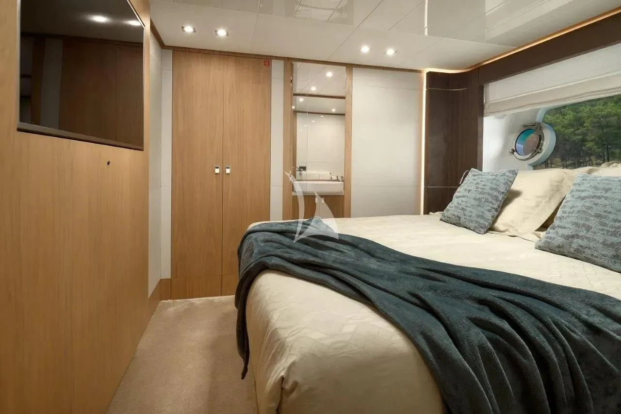 a room with a bed and a mirror aboard DAMARI Yacht for Charter