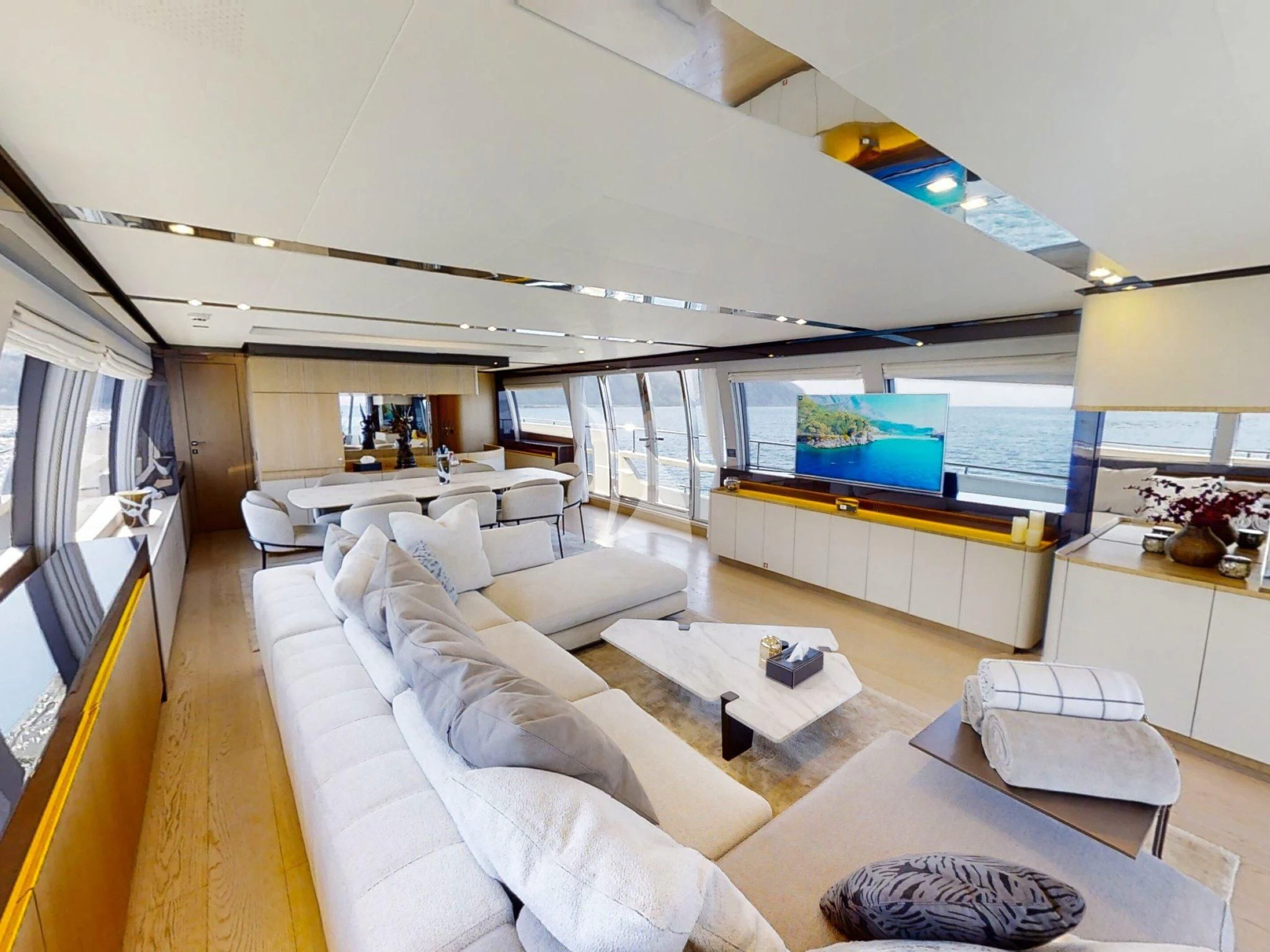 a living room with a large window aboard DAMARI Yacht for Charter