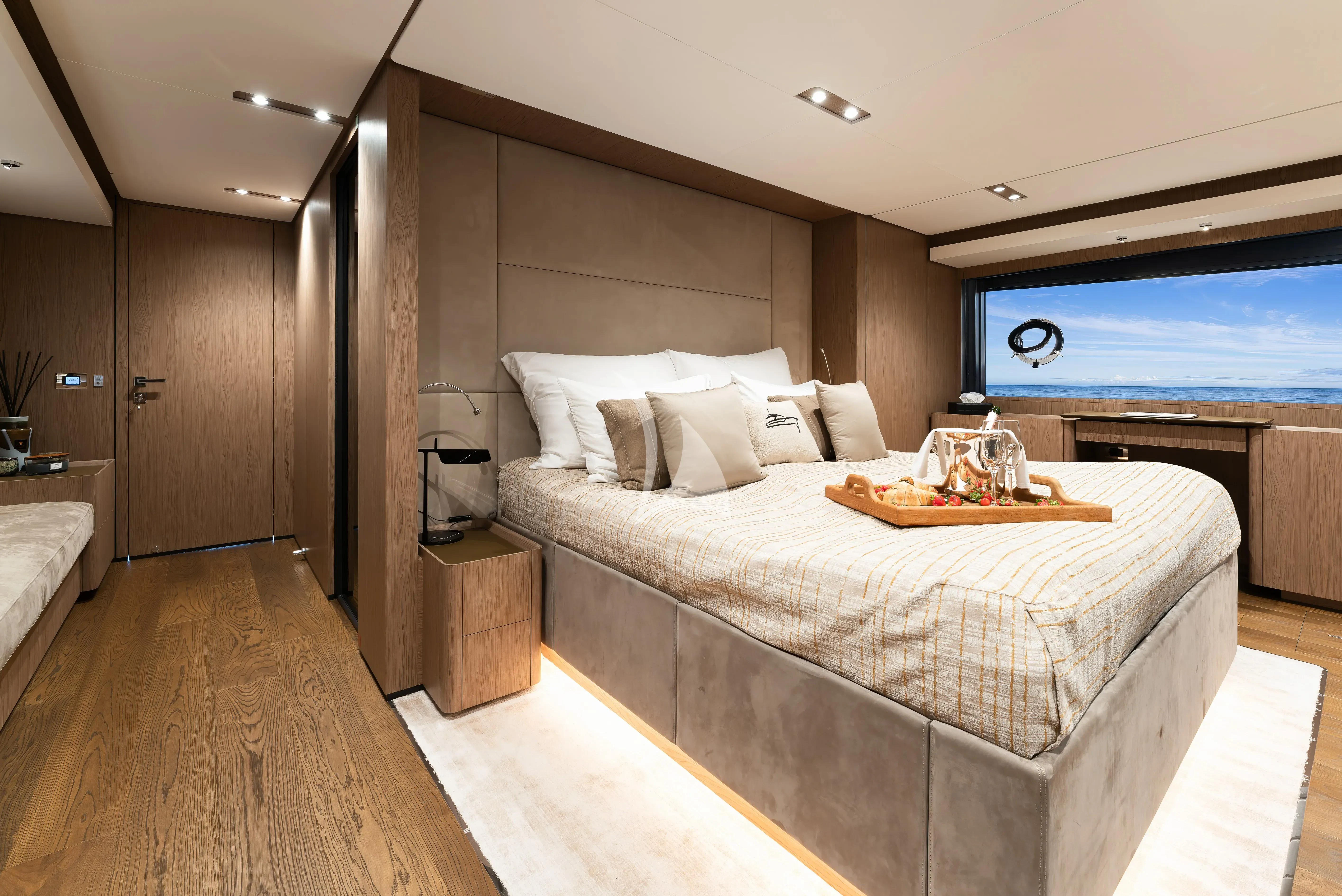 a large bedroom with a large bed aboard DAMARI Yacht for Charter