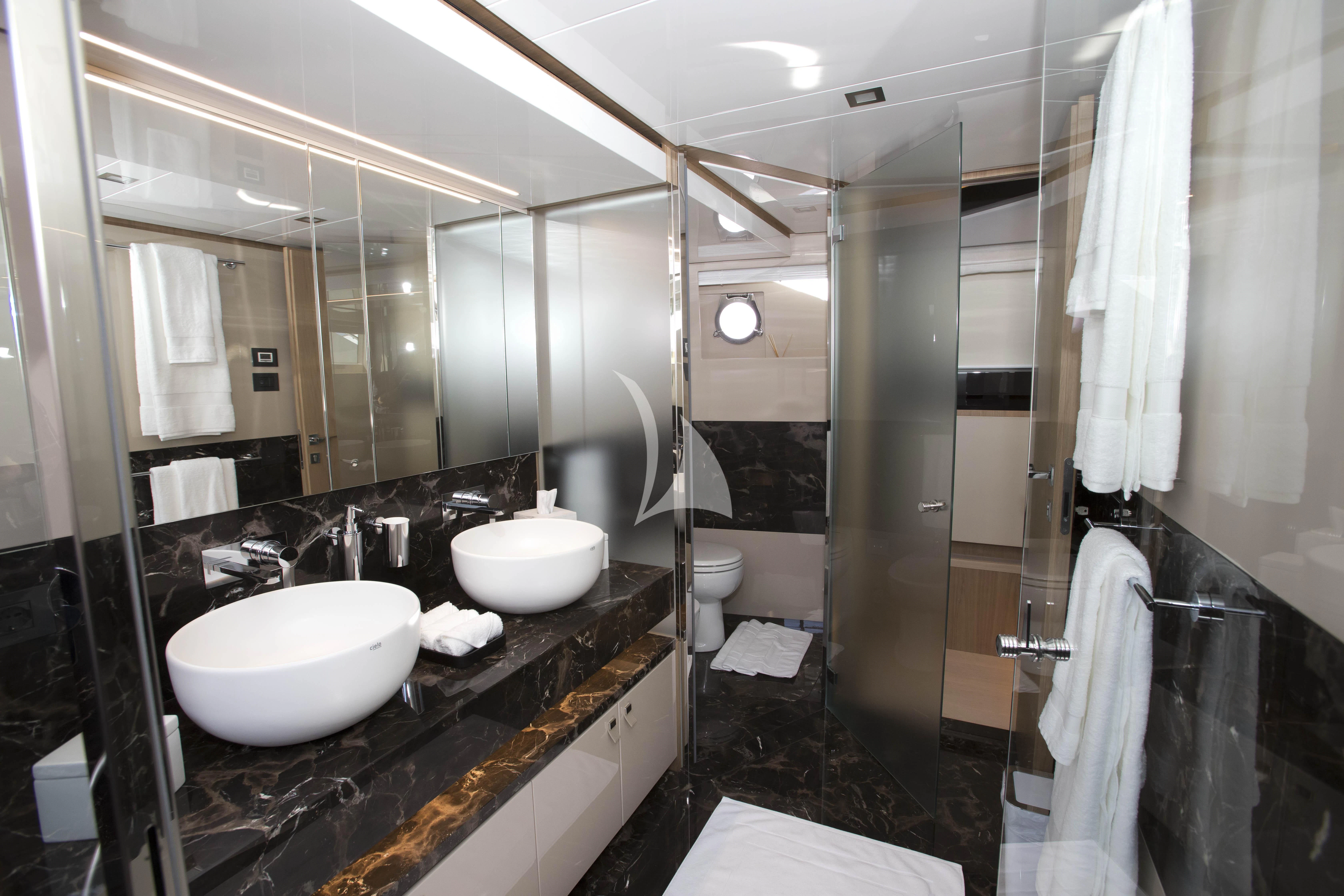 a bathroom with a large mirror aboard DAMARI Yacht for Charter