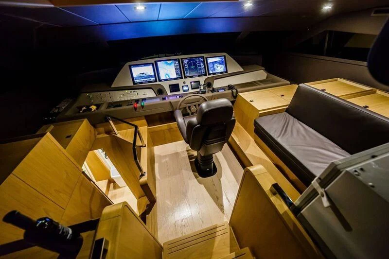 a room with computers and desks aboard DAMARI Yacht for Charter