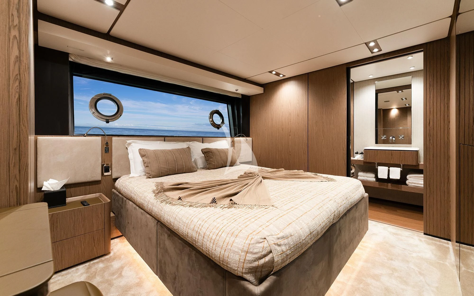 a hotel room with a bed and a tv aboard DAMARI Yacht for Charter