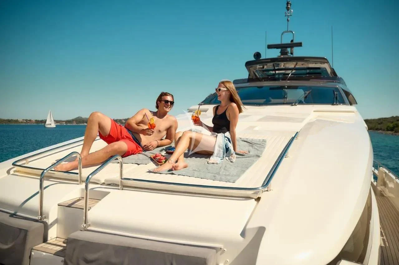 a group of people sitting on a boat aboard DAMARI Yacht for Charter