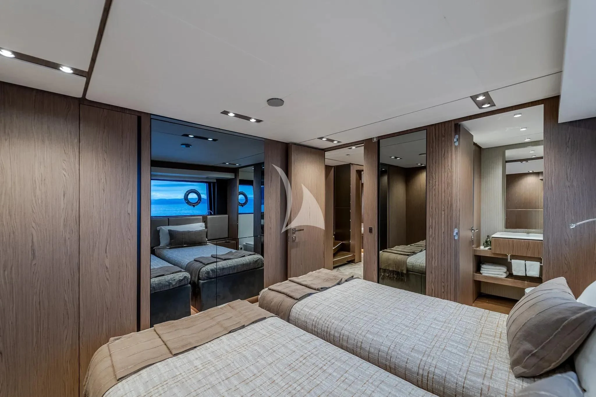 a bedroom with a bed and a couch aboard DAMARI Yacht for Charter