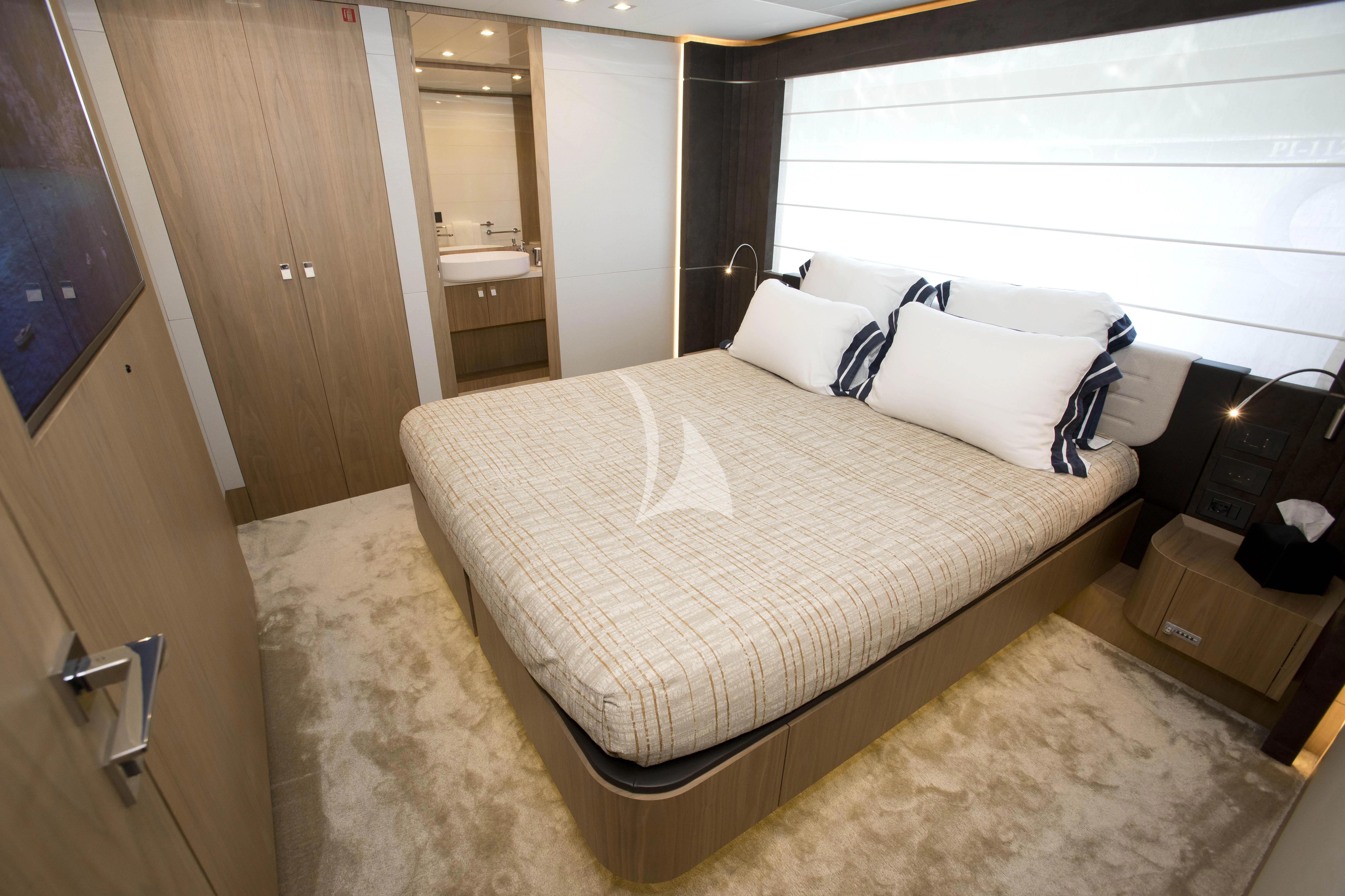 a bed in a hotel room aboard DAMARI Yacht for Charter