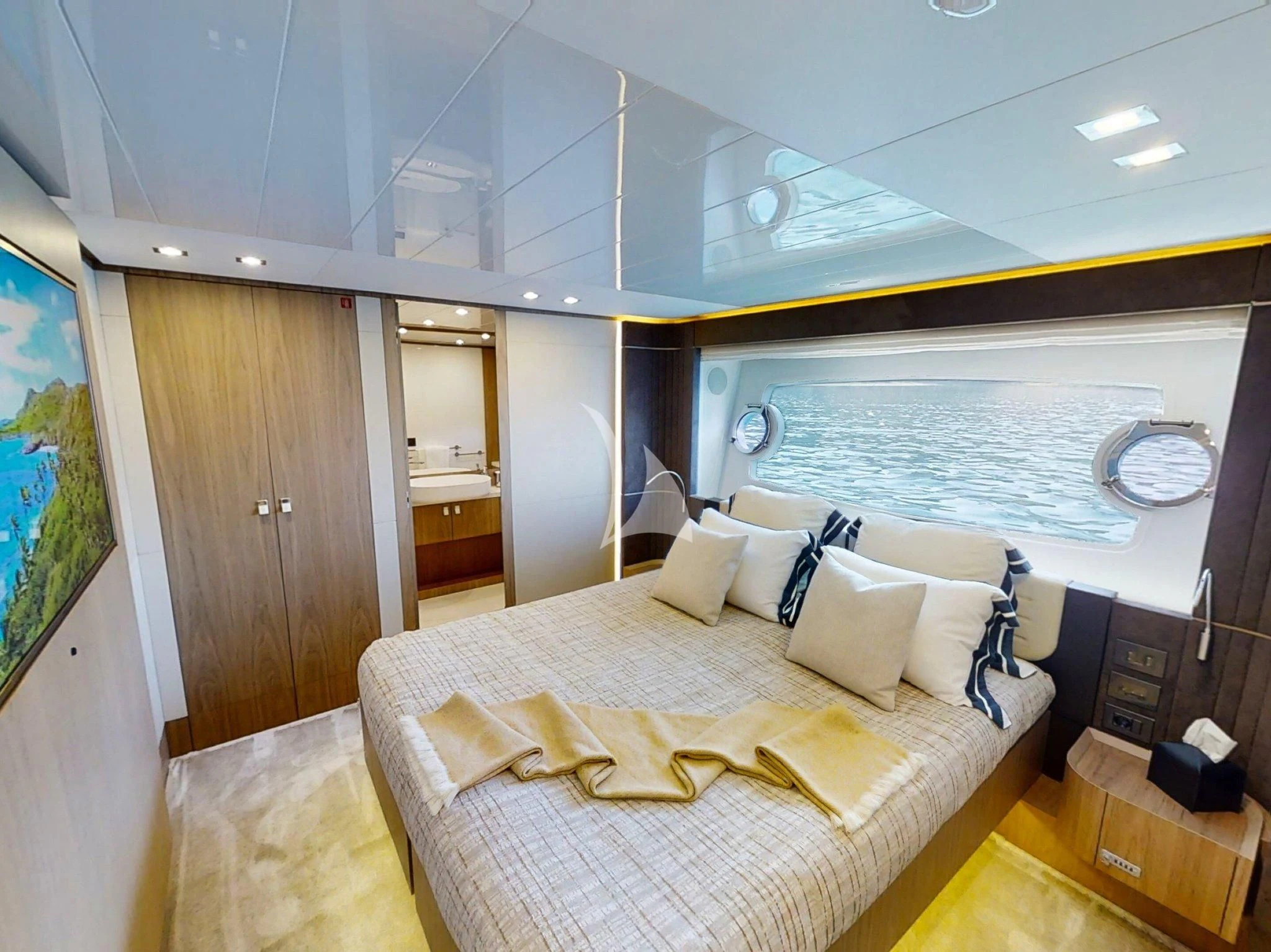 a large bedroom with a large bed aboard DAMARI Yacht for Charter