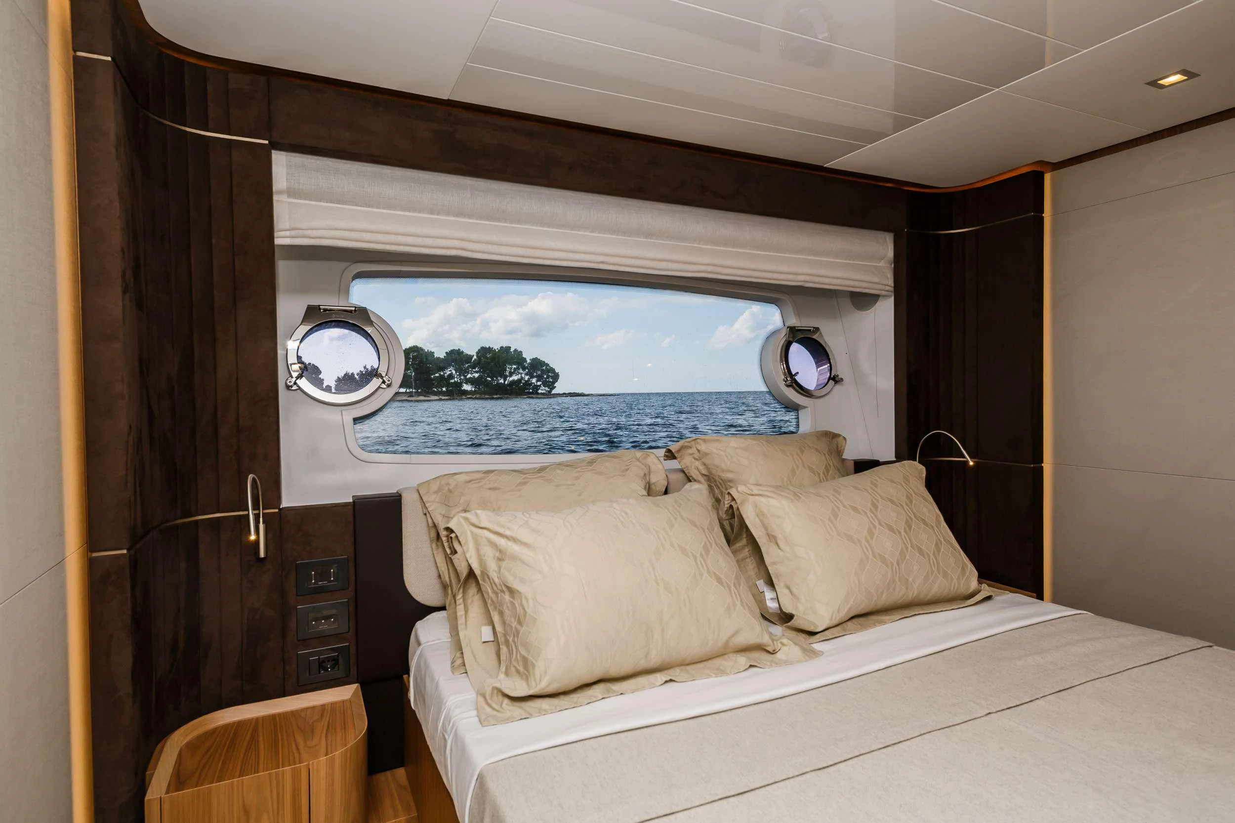 a room with a bed and a window aboard DAMARI Yacht for Charter
