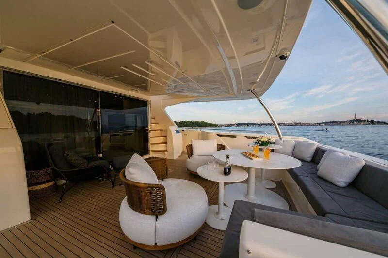a room with a table and chairs aboard DAMARI Yacht for Charter