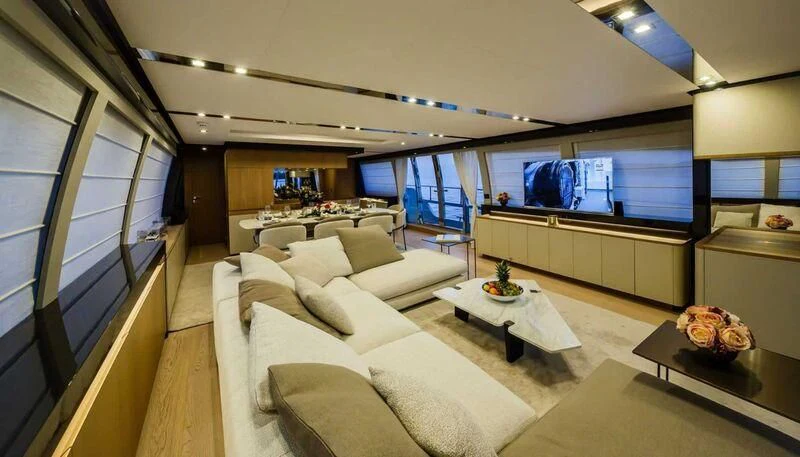 a living room with a large window aboard DAMARI Yacht for Charter
