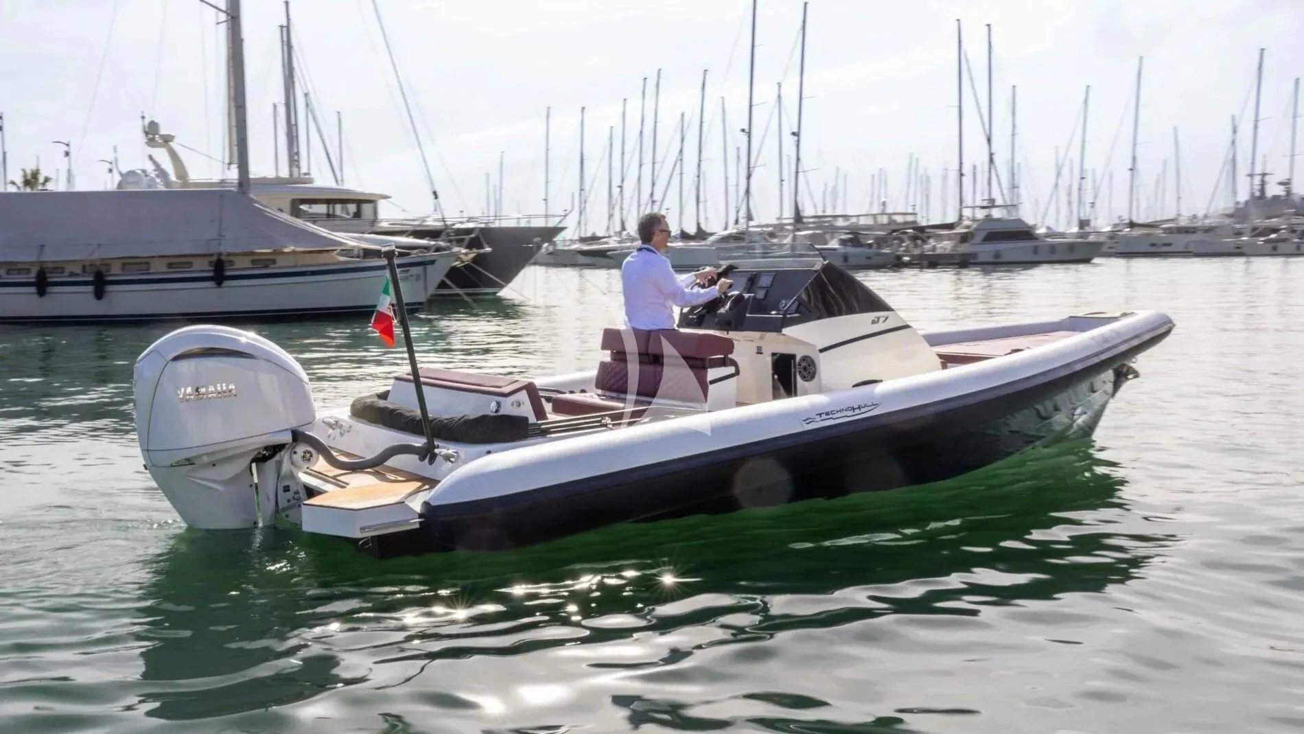 a person sitting on a boat aboard DAMARI Yacht for Charter