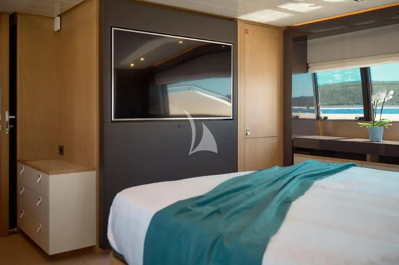 a bedroom with a large bed aboard DAMARI Yacht for Charter