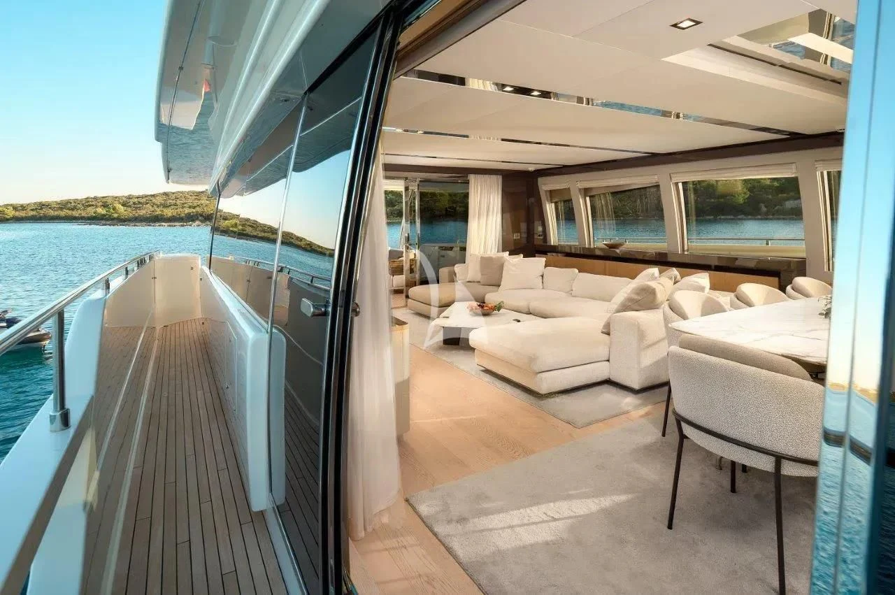 a large balcony overlooking a beach aboard DAMARI Yacht for Charter