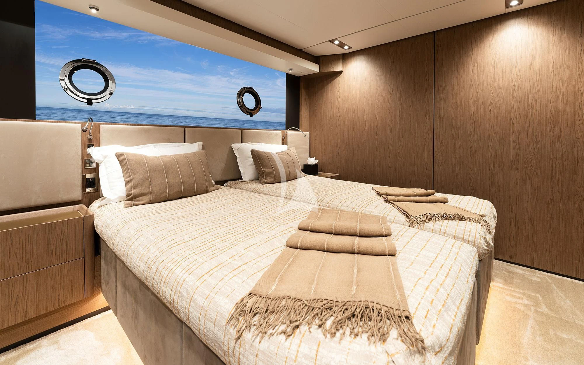 a bed with a white sheet aboard DAMARI Yacht for Charter