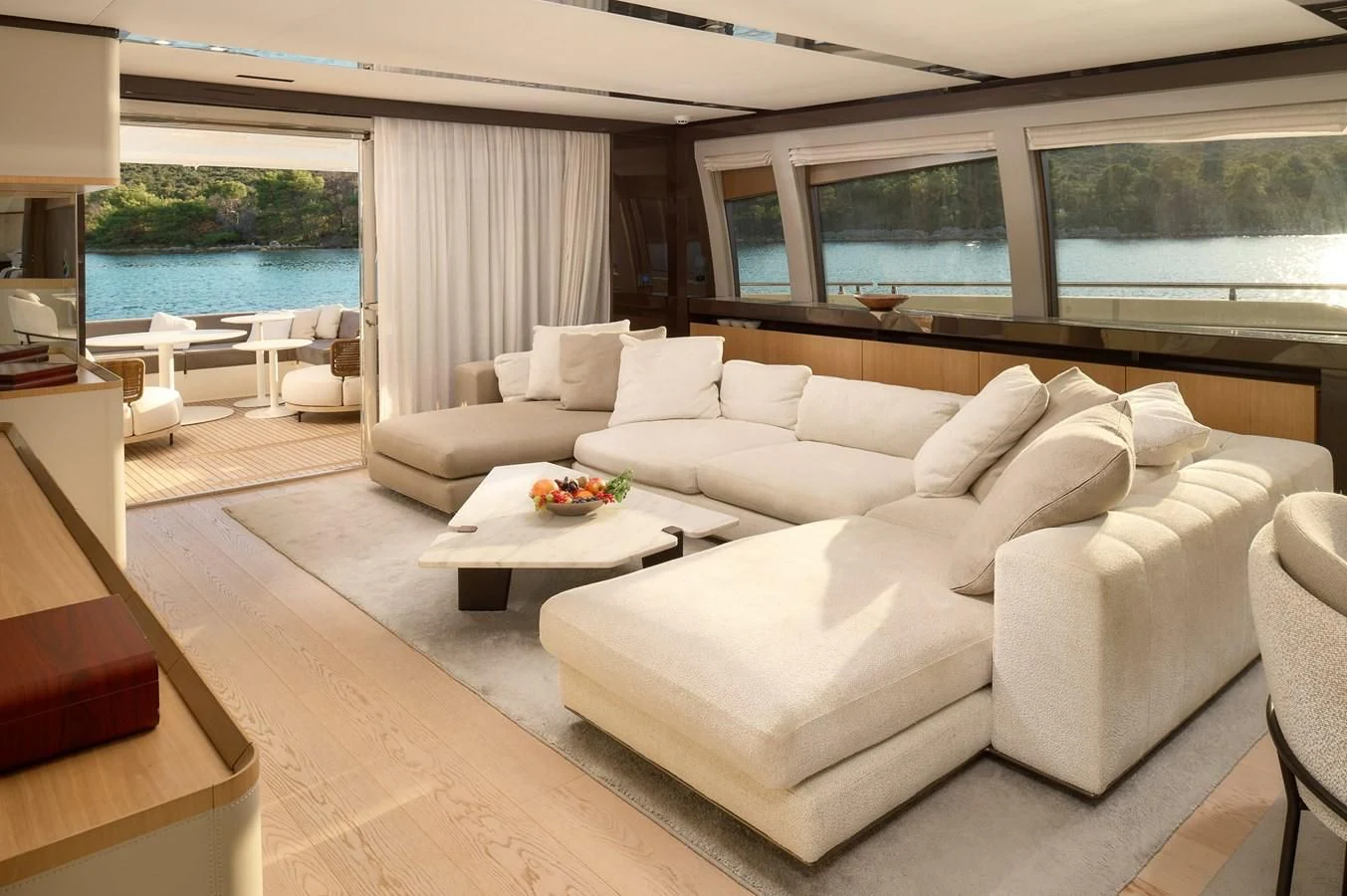 a living room with a large window aboard DAMARI Yacht for Charter