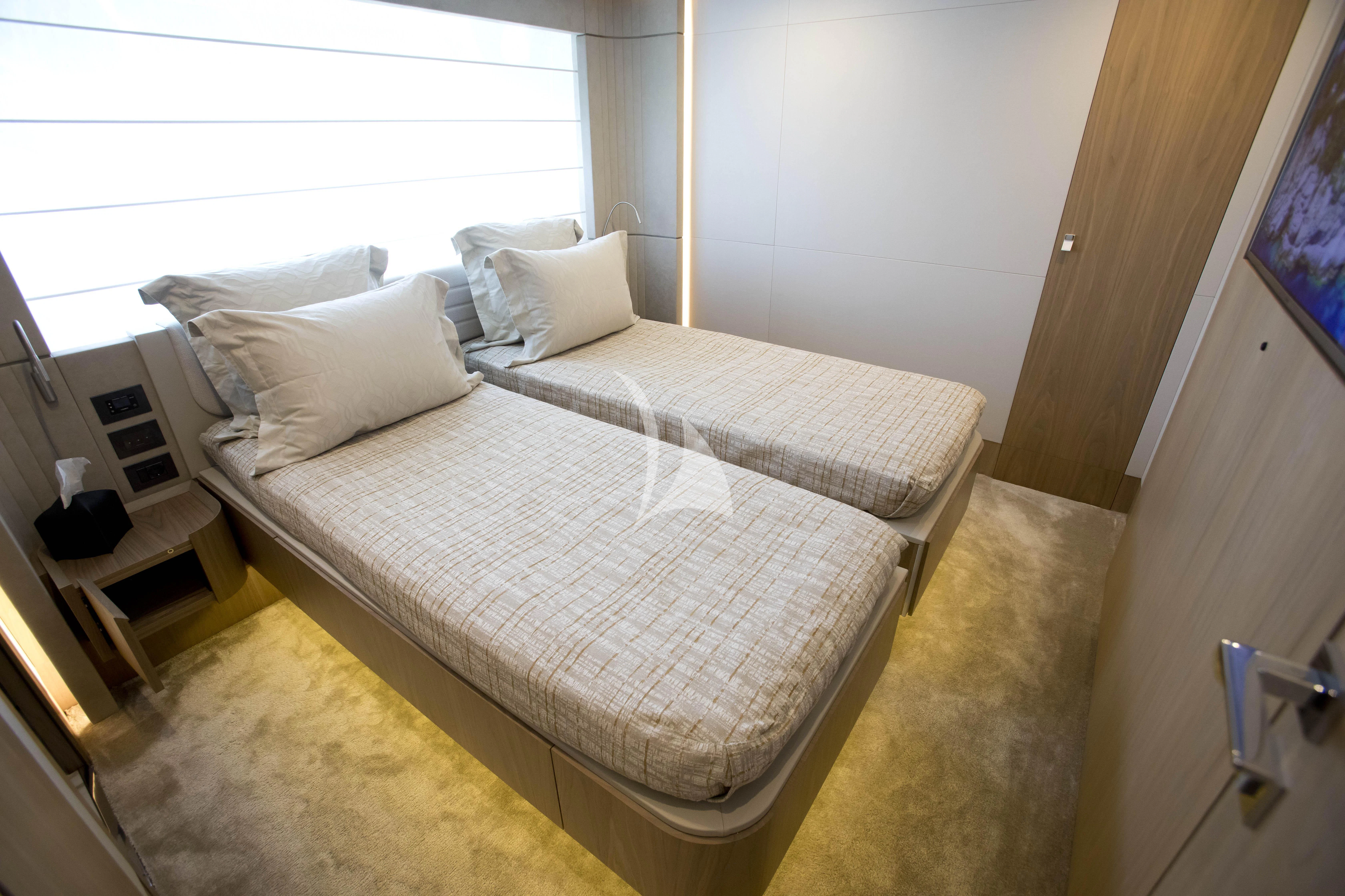 a bed with white sheets aboard DAMARI Yacht for Charter