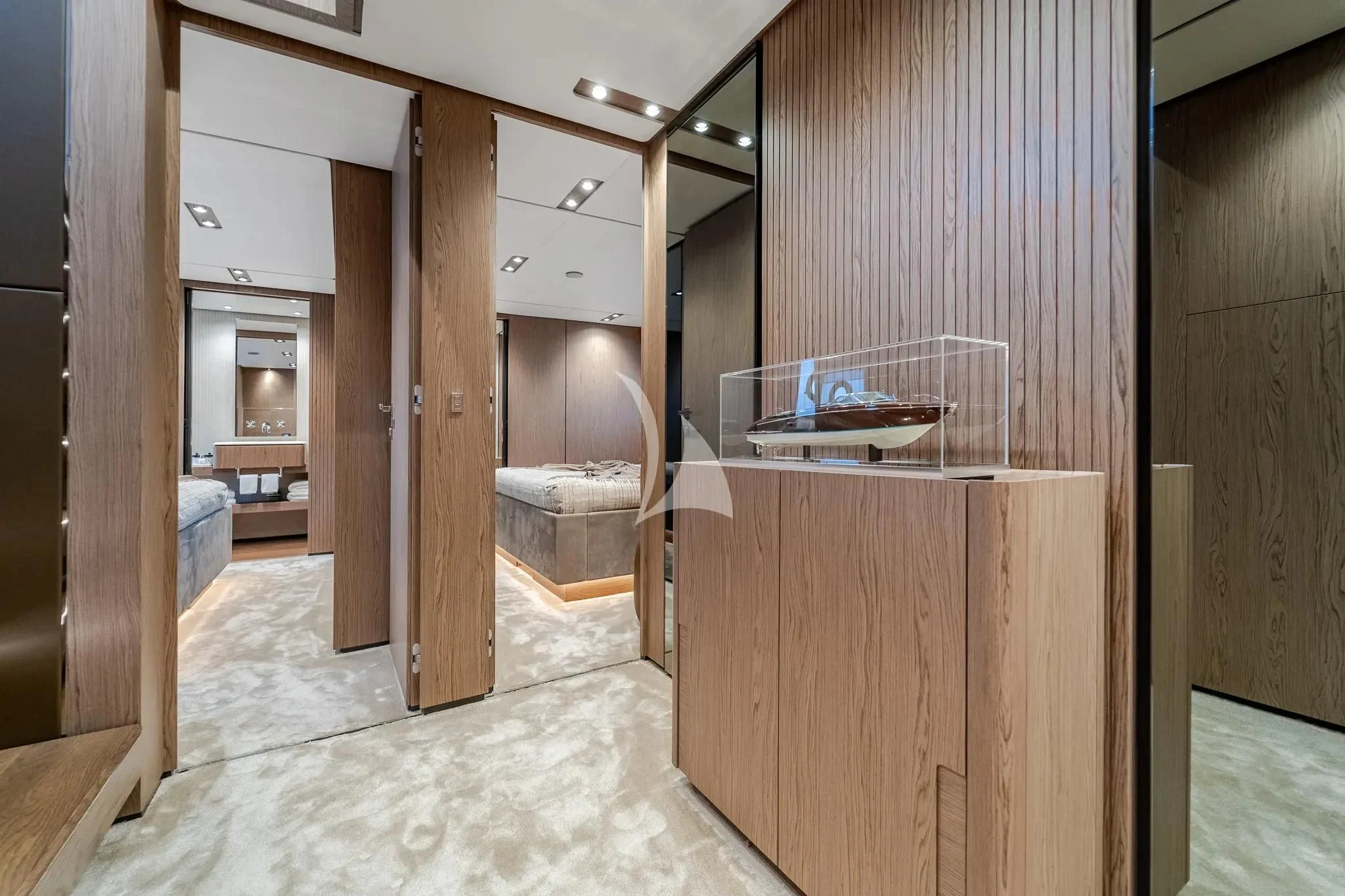 a room with a bed and a desk aboard DAMARI Yacht for Charter