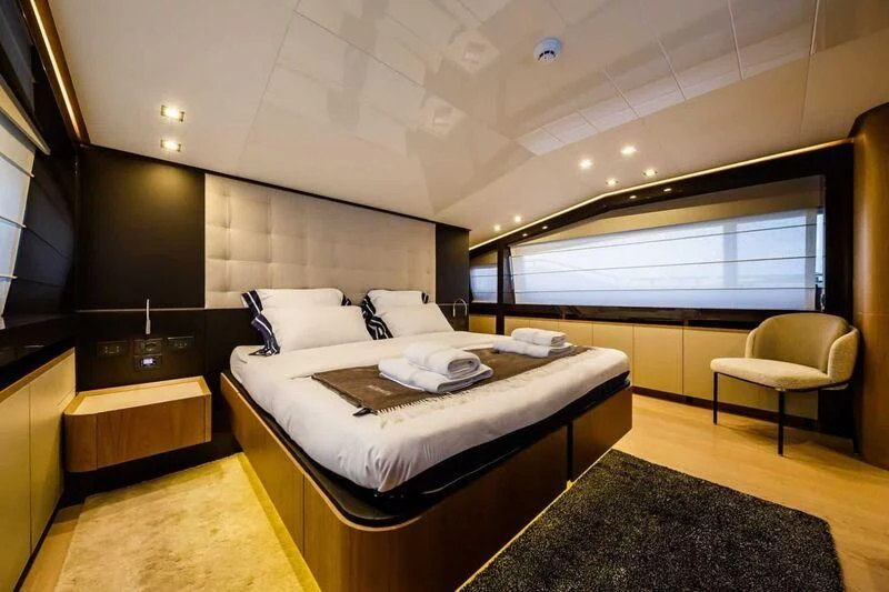 a room with a bed and a tv aboard DAMARI Yacht for Charter