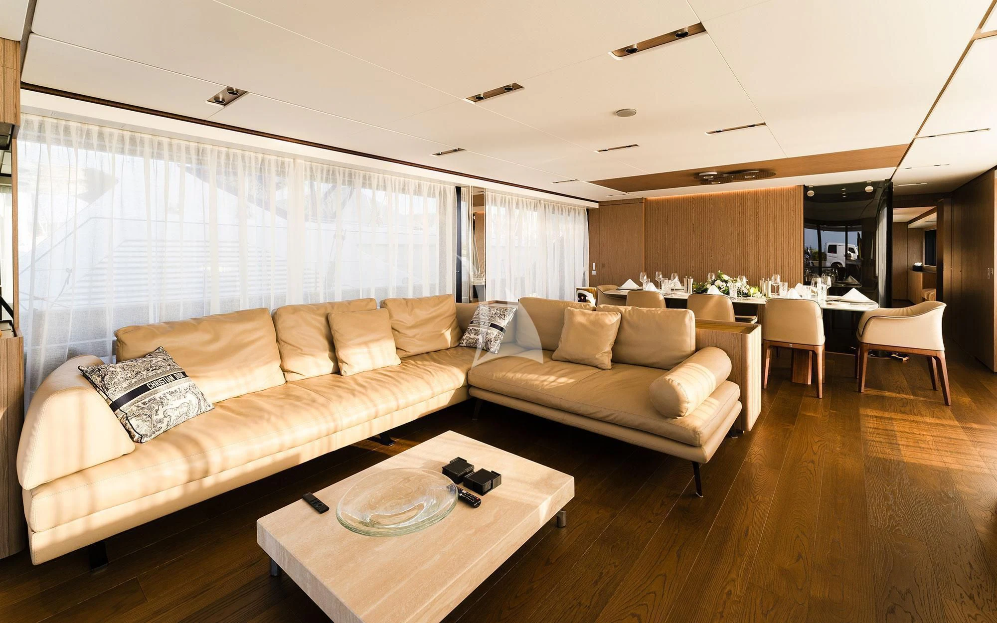 a living room with a couch and a table aboard DAMARI Yacht for Charter