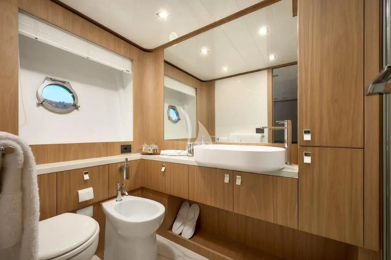 a bathroom with a sink and a toilet aboard DAMARI Yacht for Charter