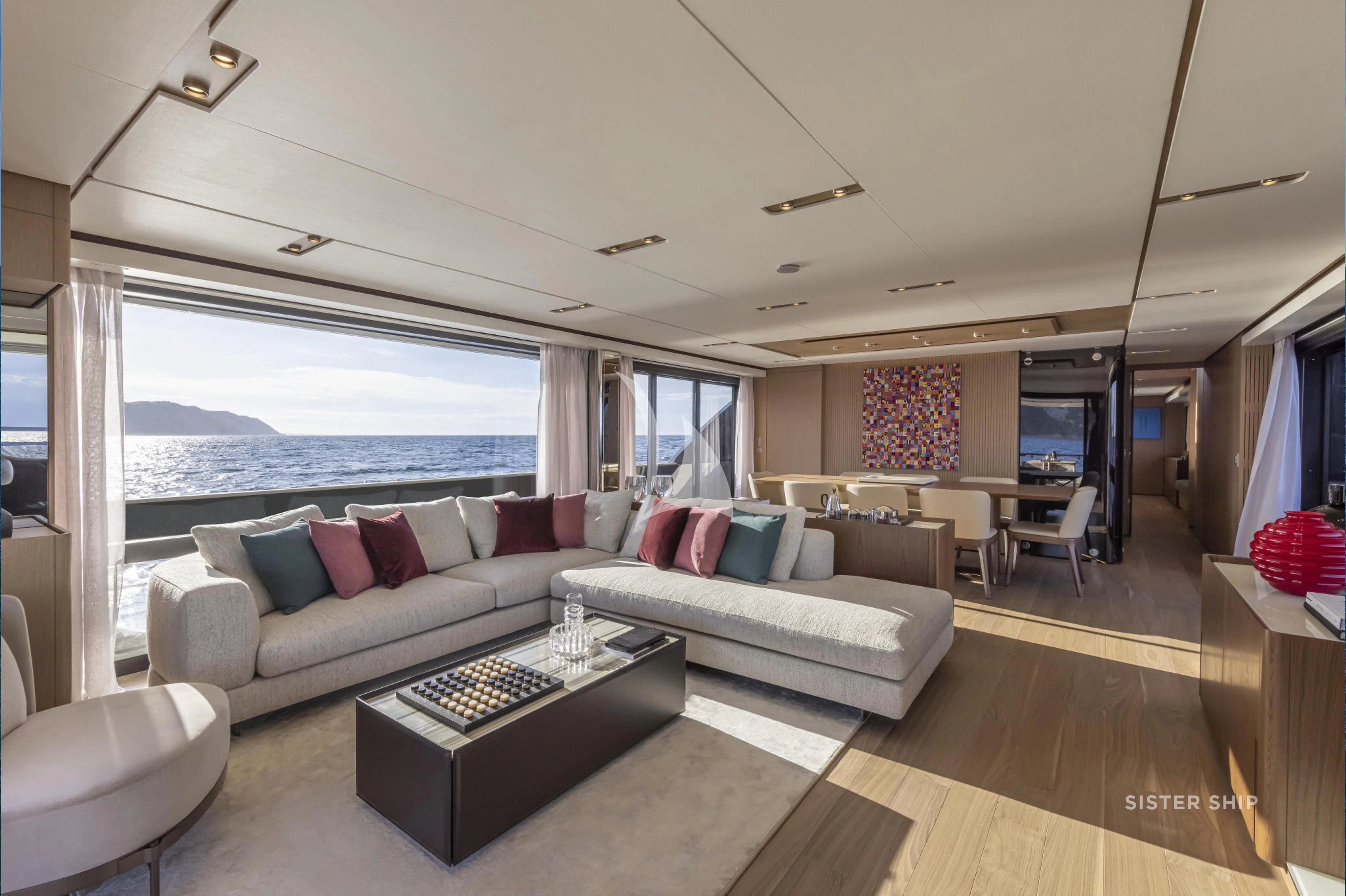 a living room with a large window aboard DAMARI Yacht for Charter