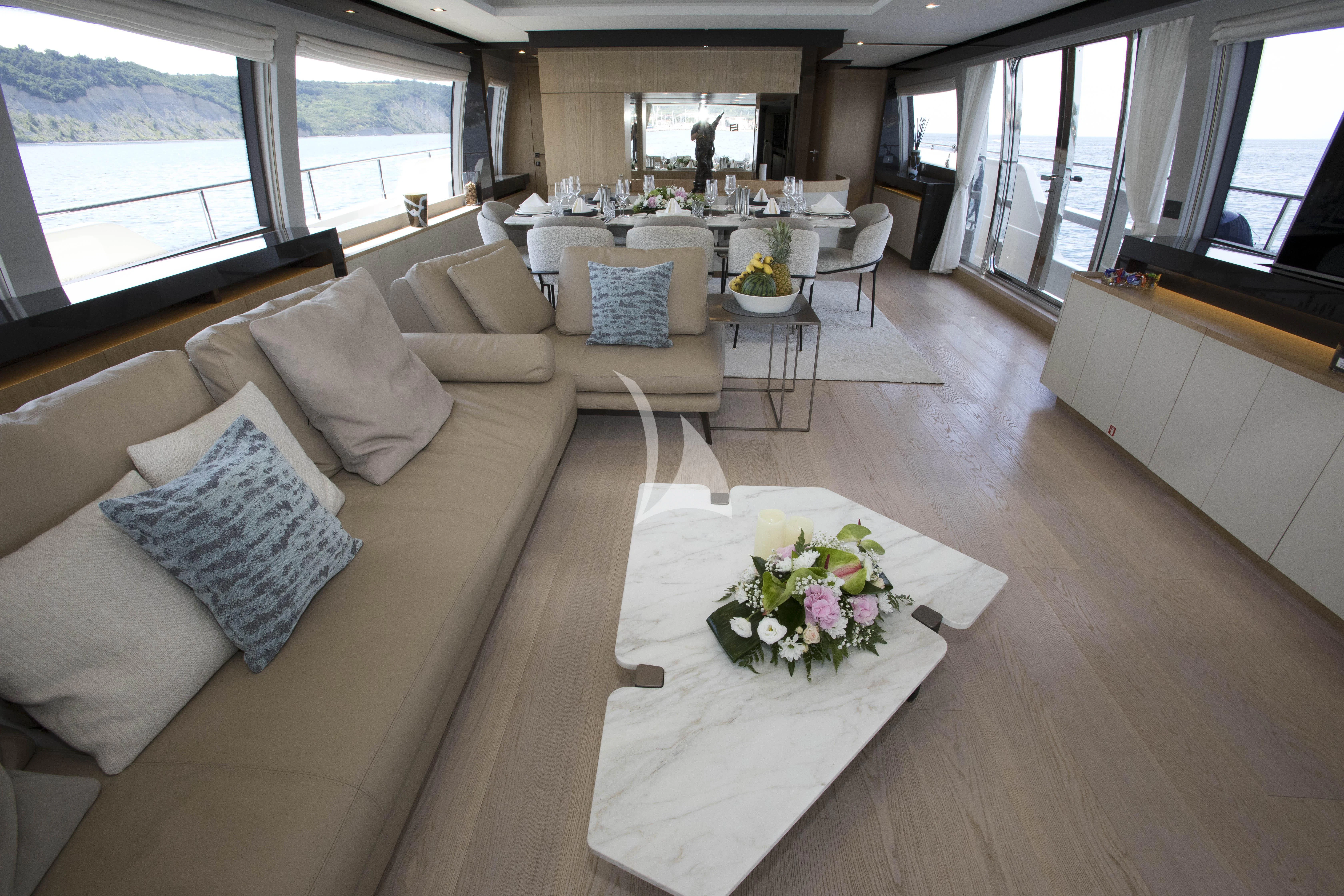 a living room with a couch and a table aboard DAMARI Yacht for Charter