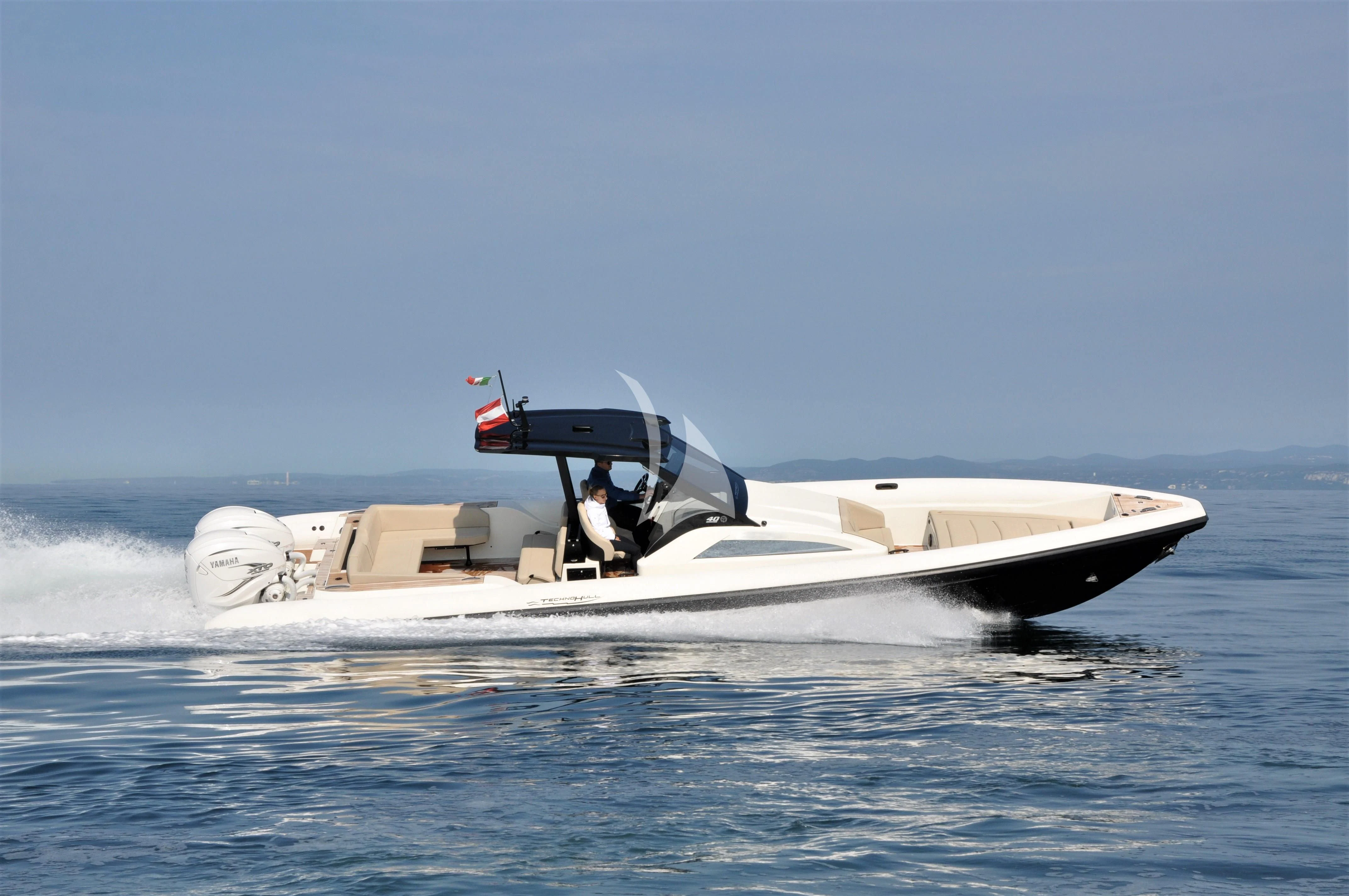 a person driving a boat aboard DAMARI Yacht for Charter
