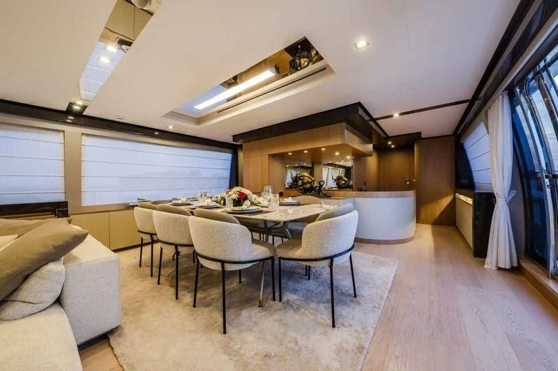 a room with a table and chairs aboard DAMARI Yacht for Charter