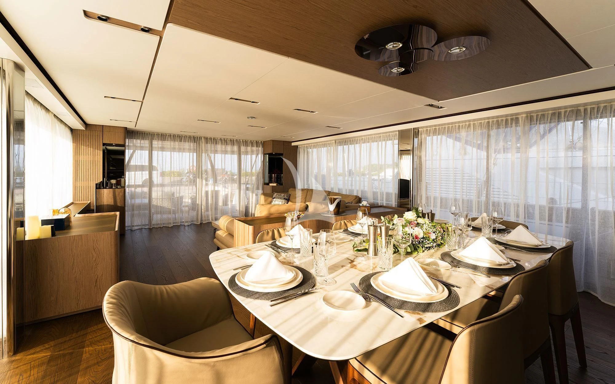 a dining room with a table set aboard DAMARI Yacht for Charter