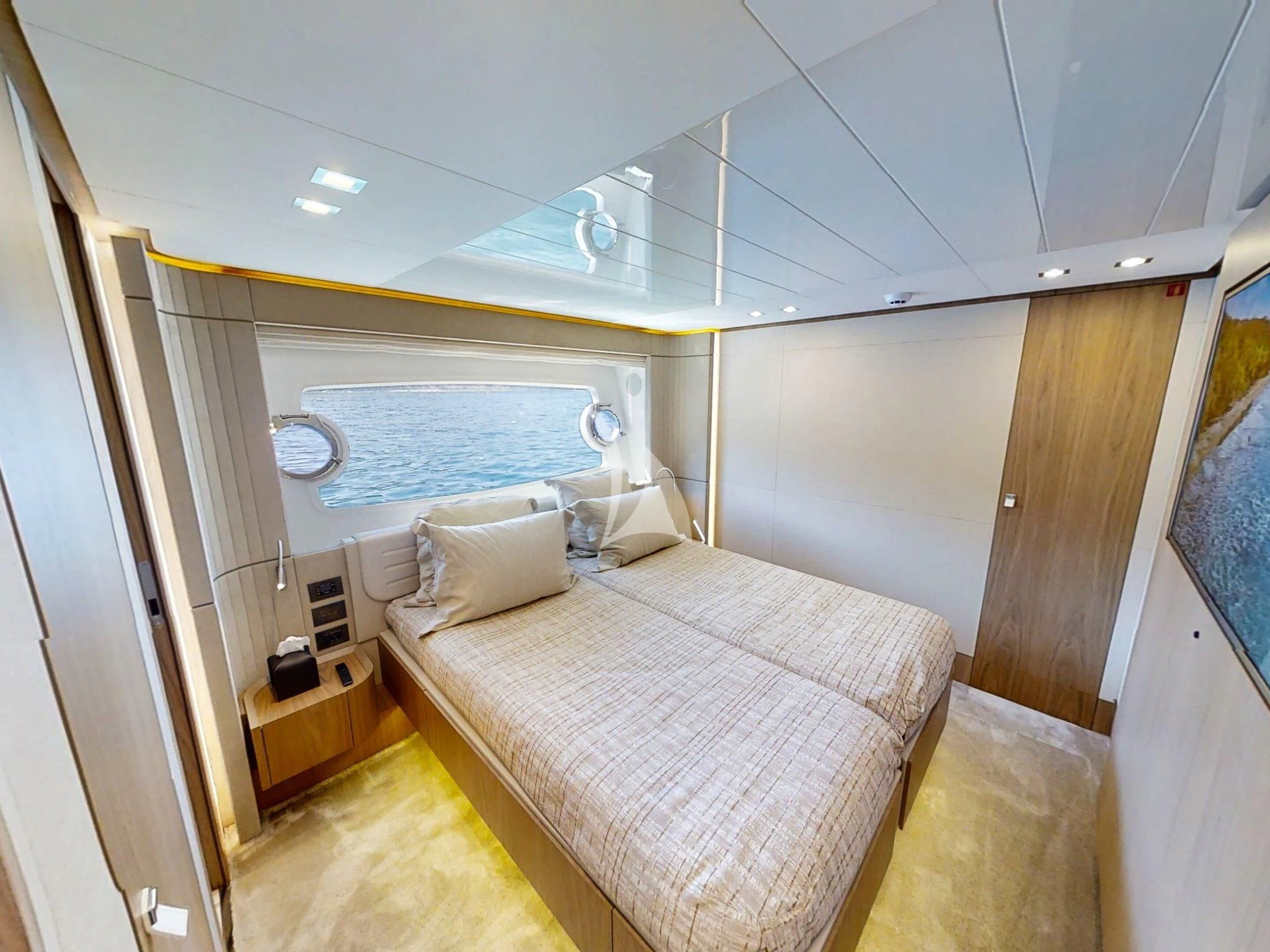 a small bedroom with a bed aboard DAMARI Yacht for Charter