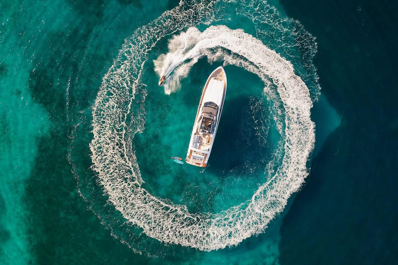 a satellite in the earth with Great Blue Hole in the background aboard DAMARI Yacht for Charter