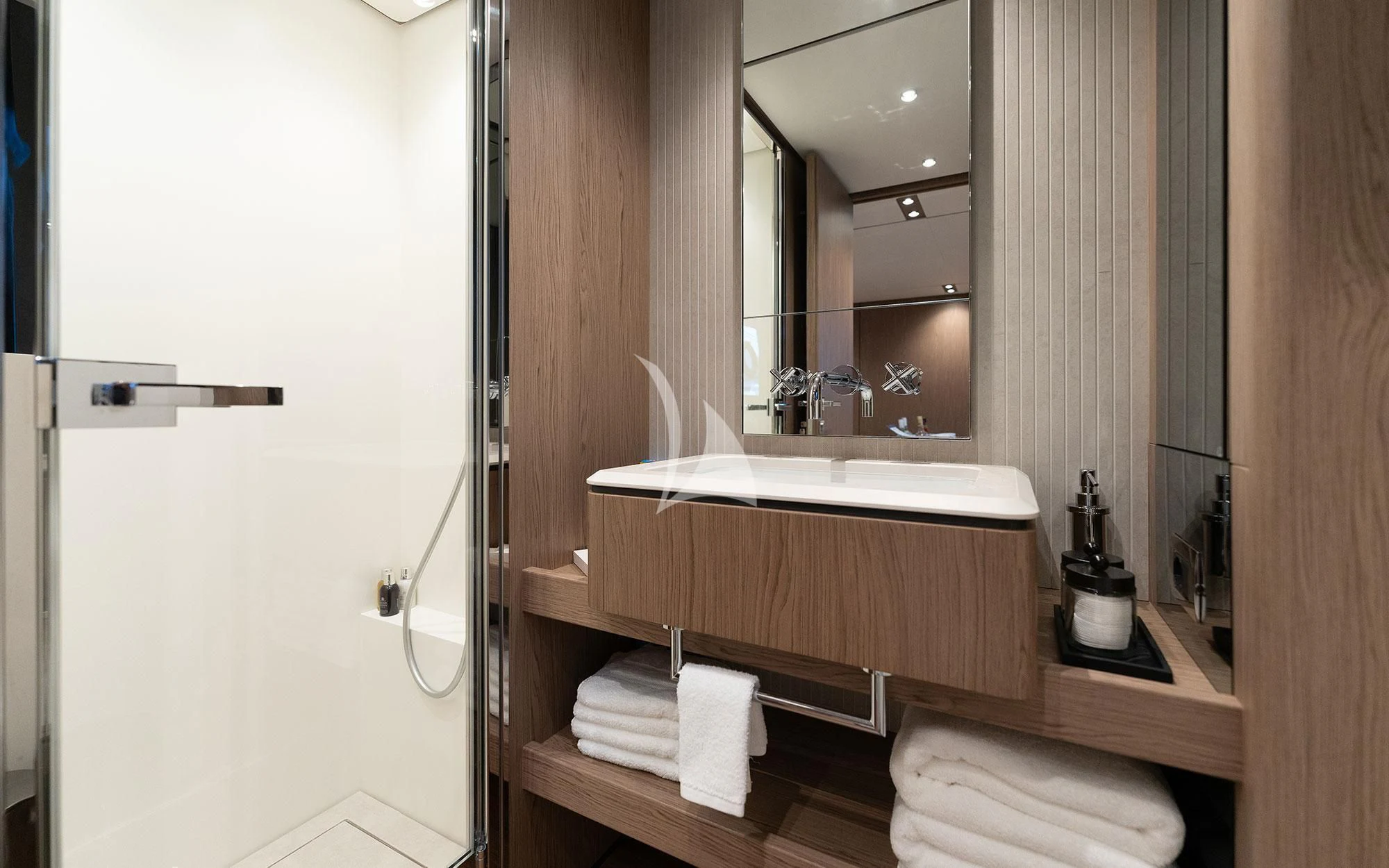 a bathroom with a sink and mirror aboard DAMARI Yacht for Charter