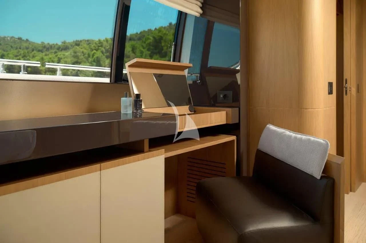 a room with a desk and chairs aboard DAMARI Yacht for Charter