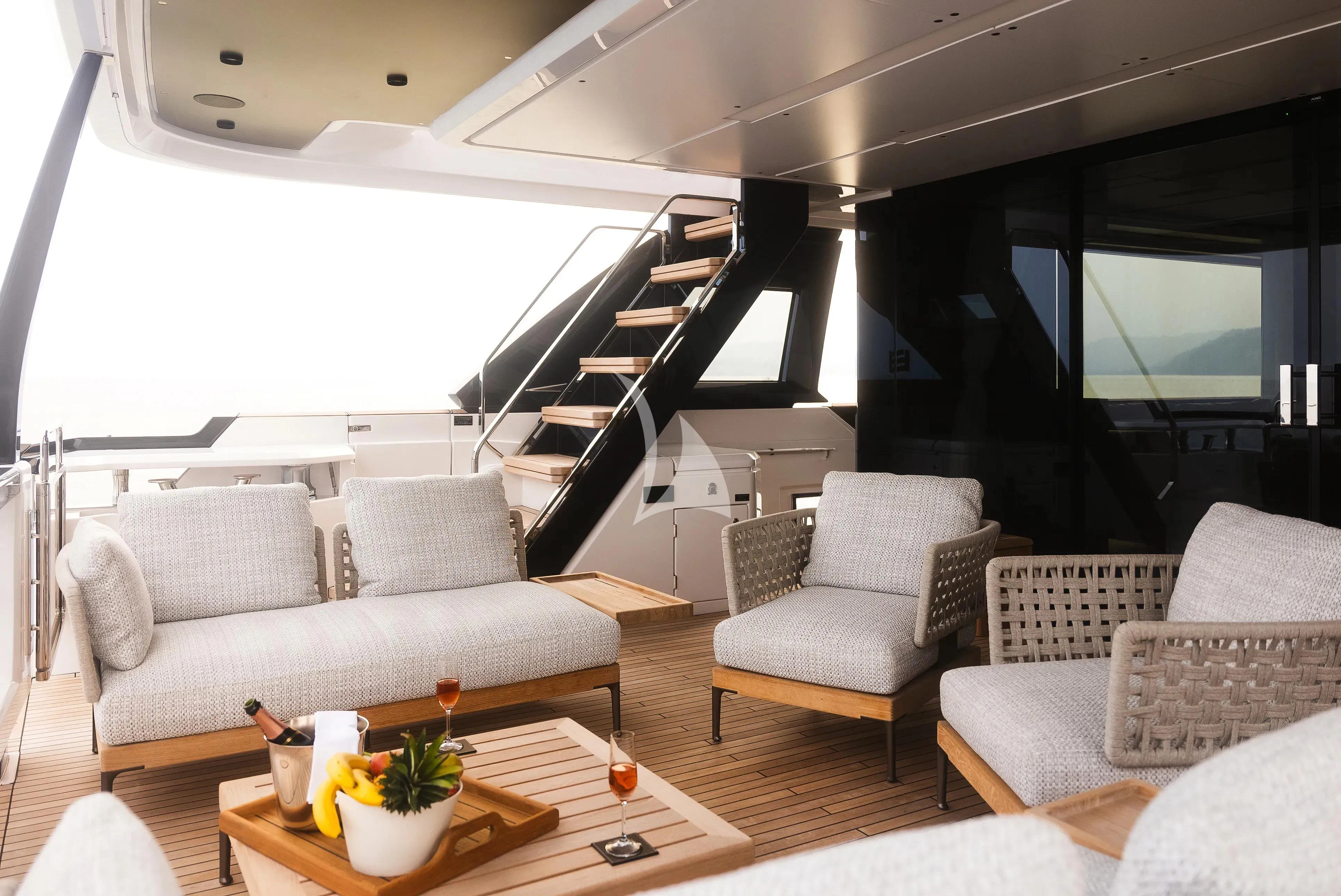 a living room with a large staircase aboard DAMARI Yacht for Charter