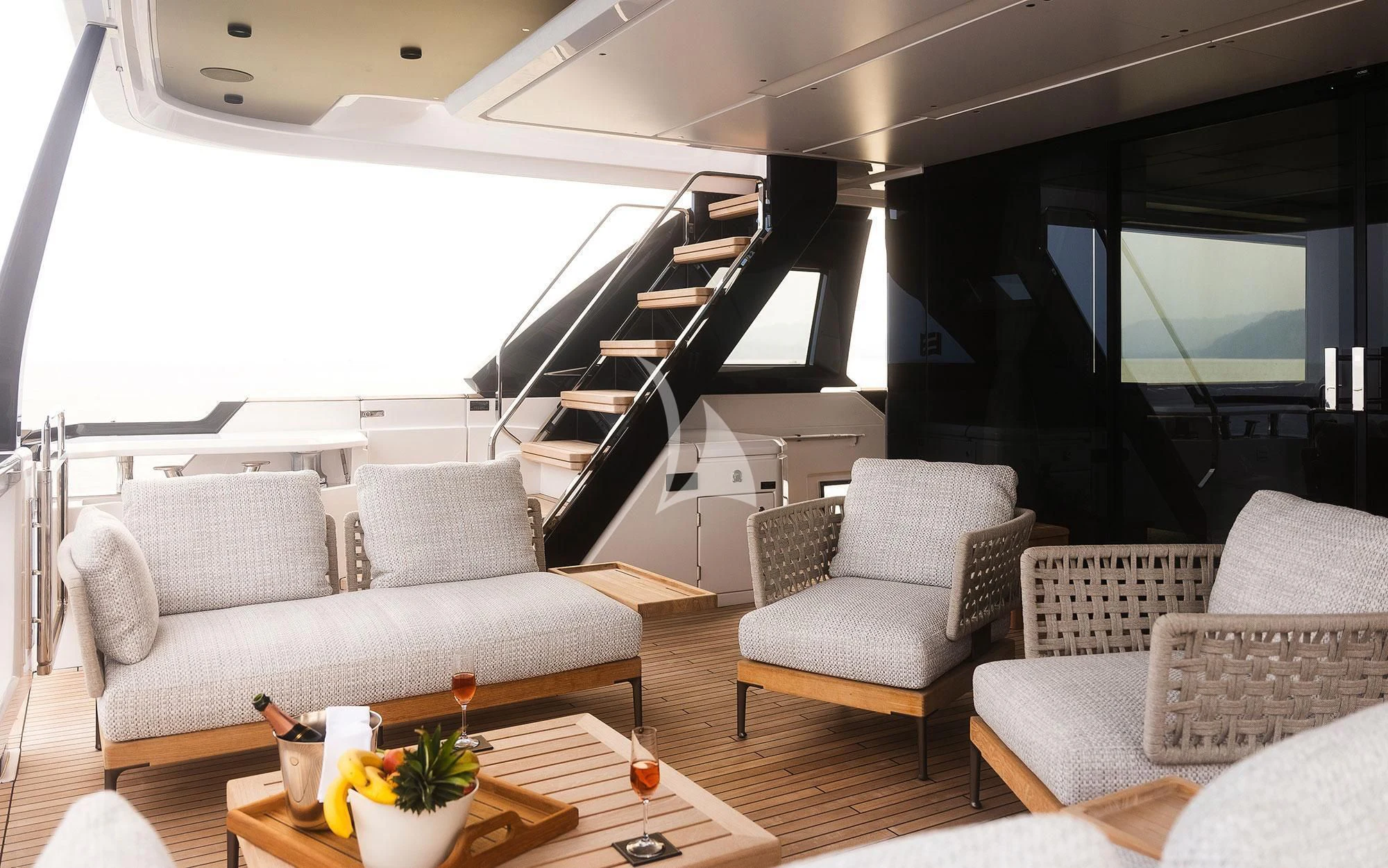 a living room with a large window aboard DAMARI Yacht for Charter