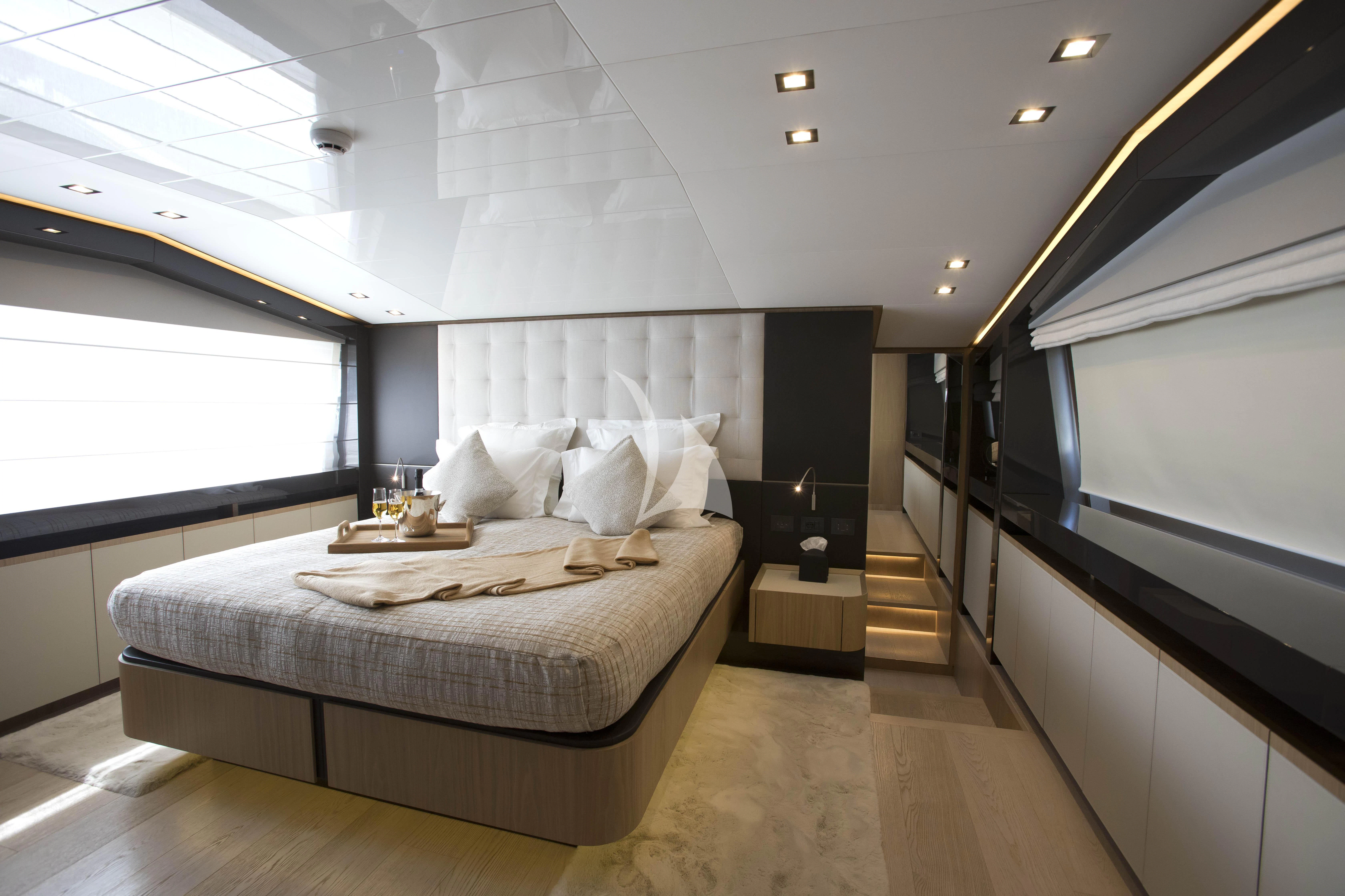 a bedroom with a large bed aboard DAMARI Yacht for Charter
