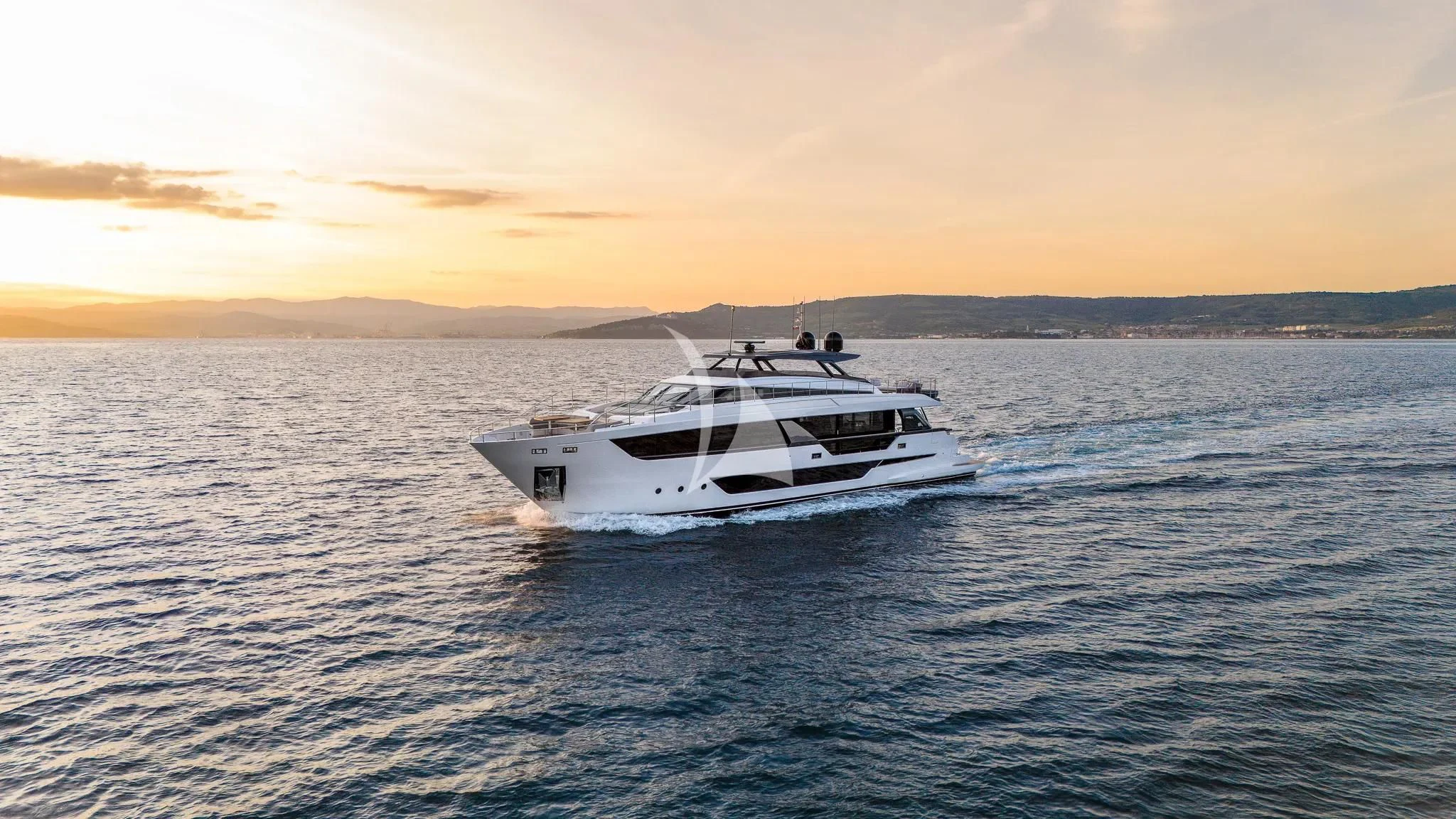 a white boat in the water aboard DAMARI Yacht for Charter